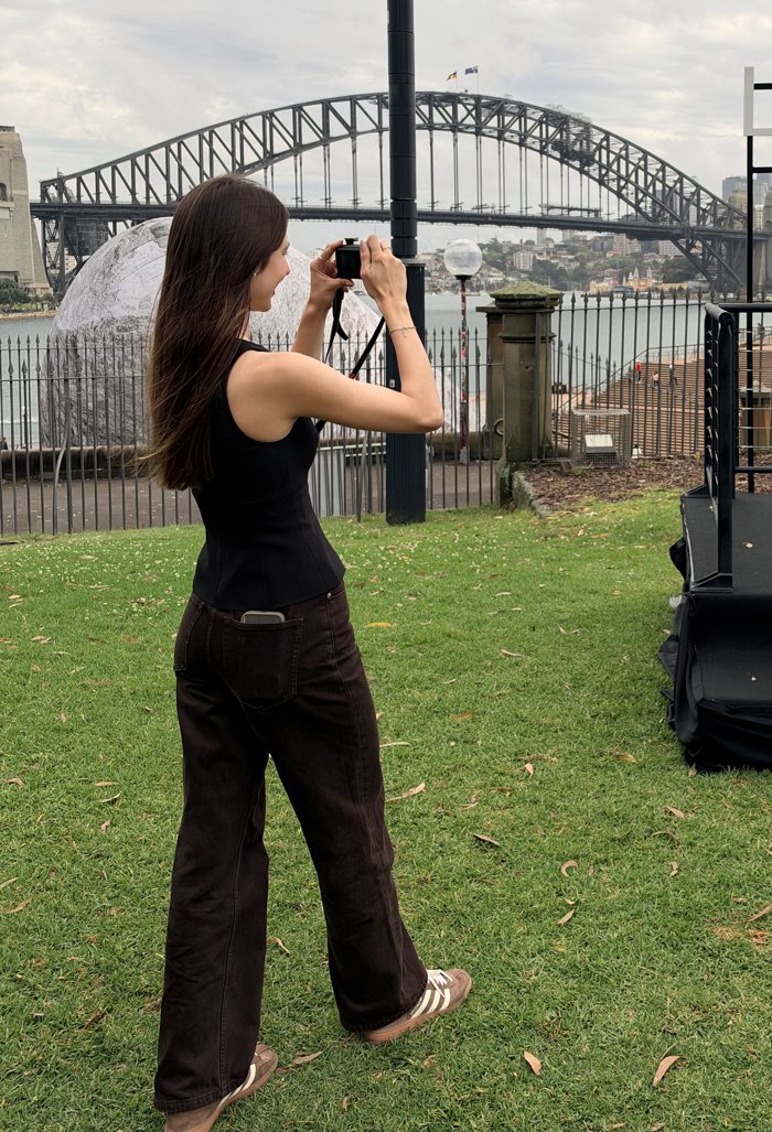 Luiza photographing a model at a L'Oréal Paris event by Sydney Harbour